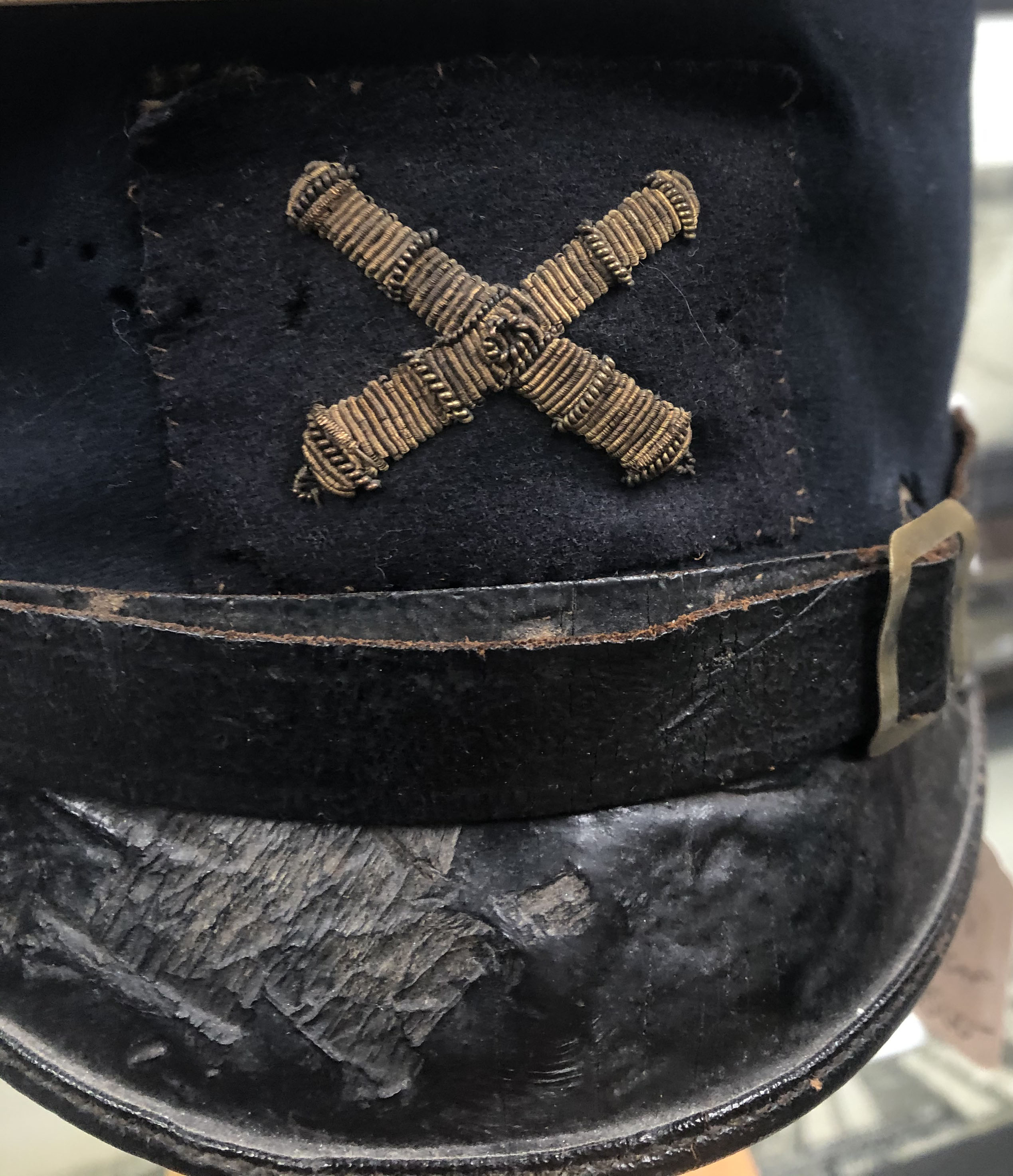 The original cap with insignia in place.